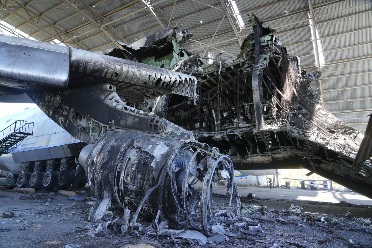 The gutted remains of an Antonov An-225, the world's biggest cargo aircraft, destroyed during recent fighting between Russian and Ukrainian forces, at the Antonov airport in Hostomel, on the outskirts of Kyiv, Ukraine, Thursday, May 5, 2022. (AP Photo/Efrem Lukatsky)