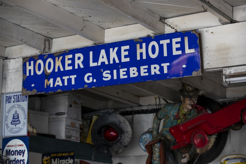 A sign for a Salem, Wisconsin hotel hangs at Bay Auto Service in Costa Mesa.