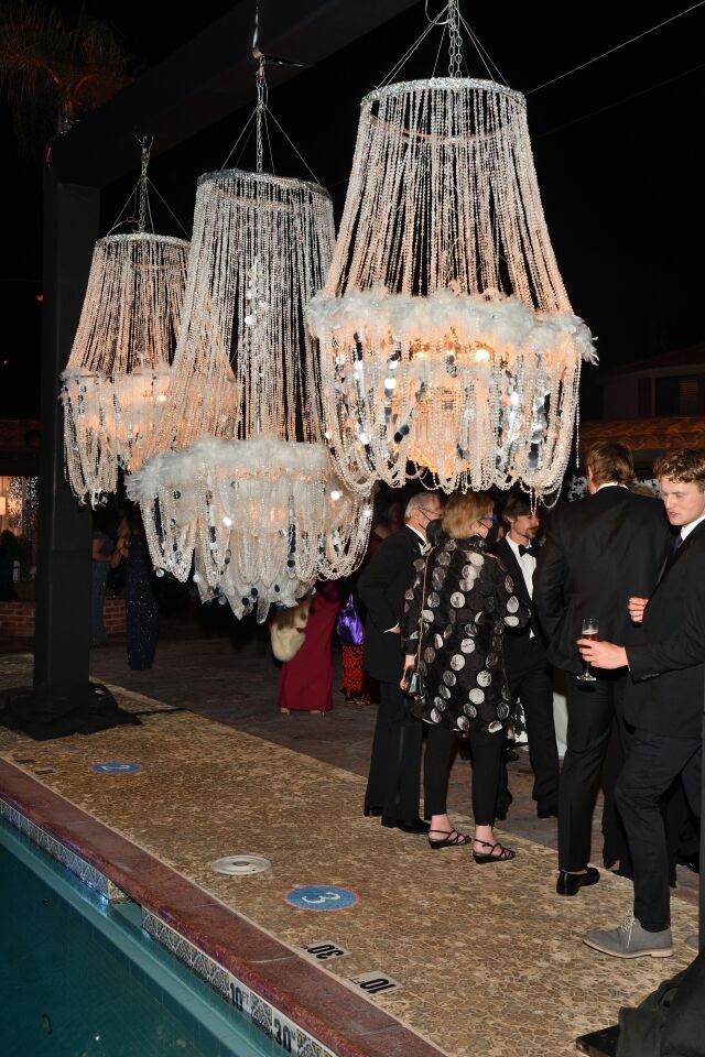 Stunning decor-chandeliers by the pool