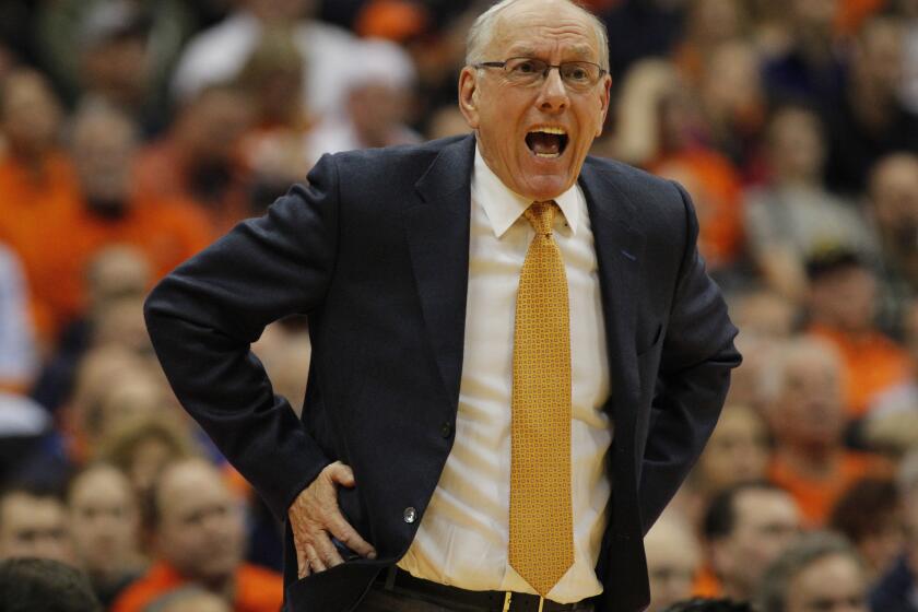 Syracuse Coach Jim Boeheim yells to his players during a game against Wisconsin on Wednesday.