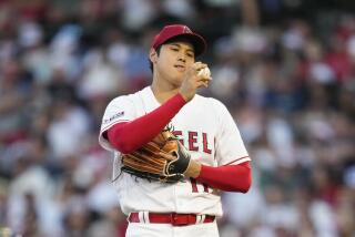 Los Angeles Angels starting pitcher Shohei Ohtani (17) looks at a ball during the fourth inning.