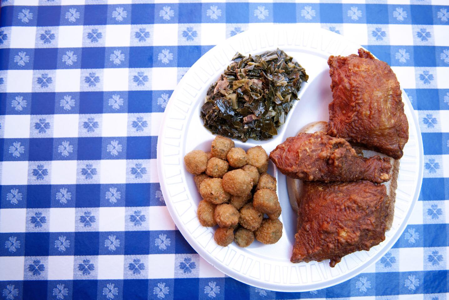 Fried okra, greens and fried chicken are served up at Gus's Fried Chicken in Arlington Heights.