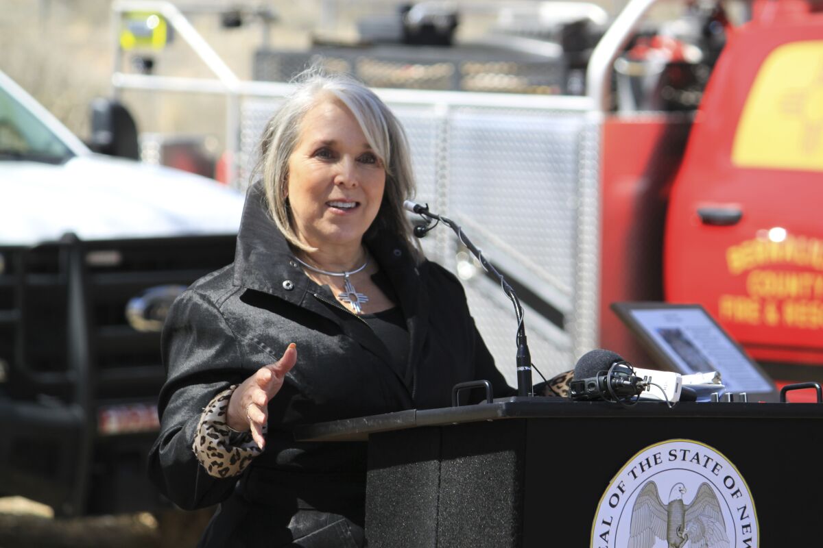 New Mexico Gov. Michelle Lujan Grisham urges caution as wildfire season gets under way during a news conference at the Rio Grande Nature Center State Park in Albuquerque, N.M., Wednesday, March 29, 2023. The governor said the state has already had more than 100 fires since the start of the year. (AP Photo/Susan Montoya Bryan)