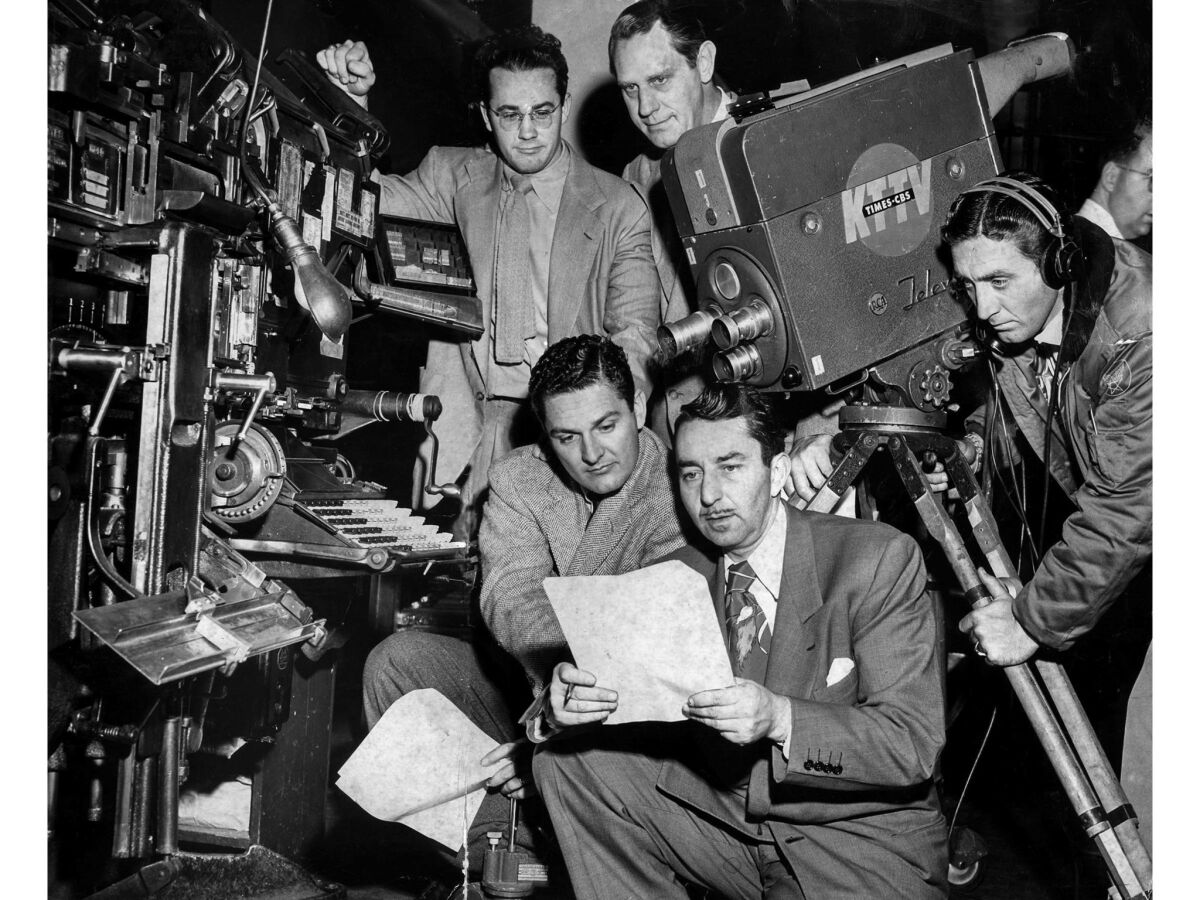 Jan. 18, 1951: A film crew from KTTV-TV lines up a shot of a Linotype machine in the Los Angeles Times composing room.