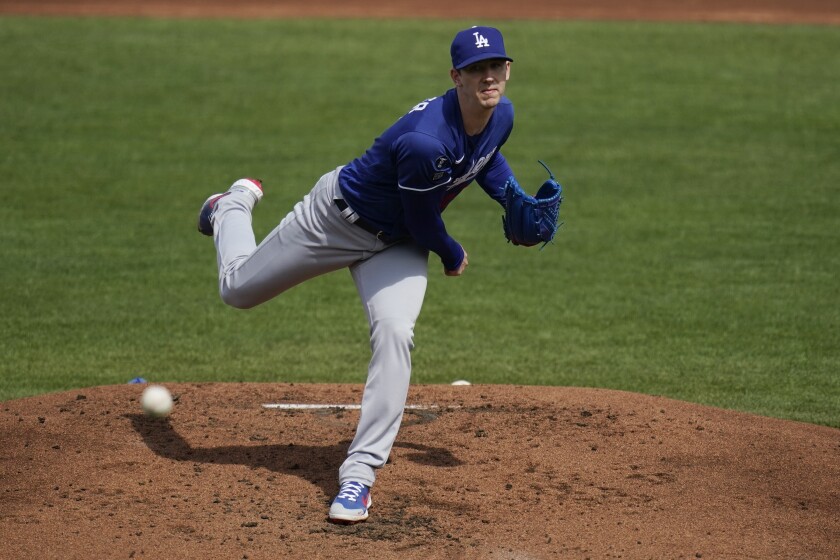 Dodgers starting pitcher Walker Buehler throws against the Cleveland Indians in the first inning Friday.