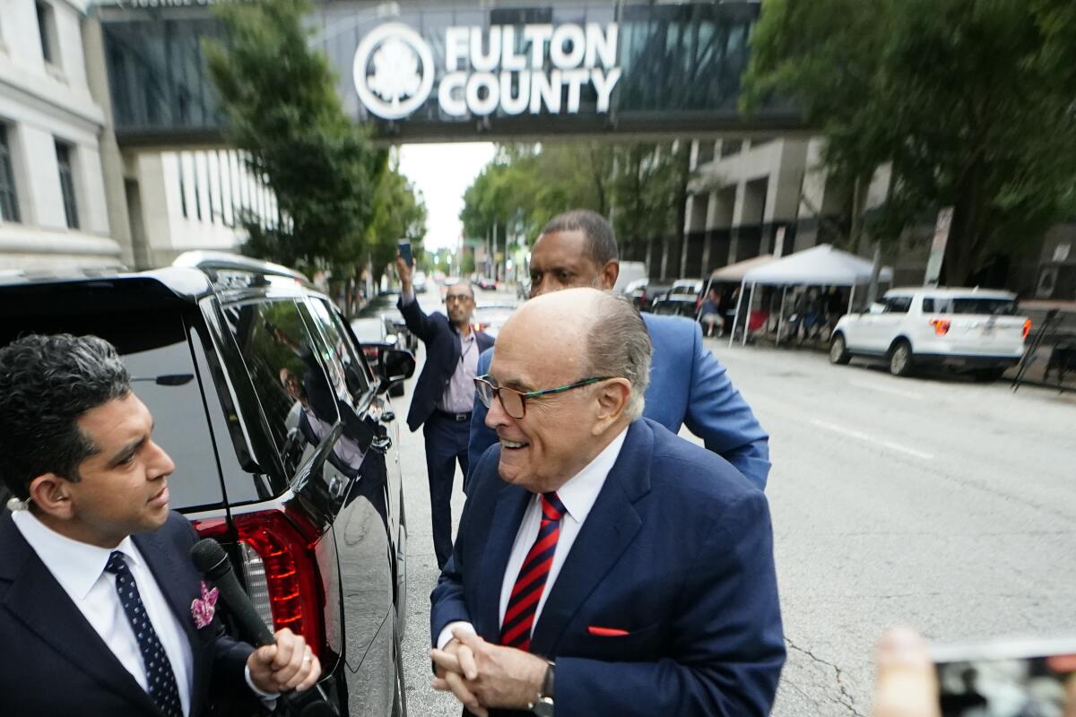 Rudolph W. Giuliani arriving at the Fulton County Courthouse in Atlanta