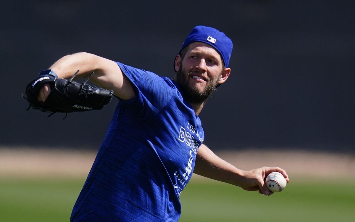 Dodgers pitcher Clayton Kershaw warms up during a spring training workout March 13 in Phoenix.