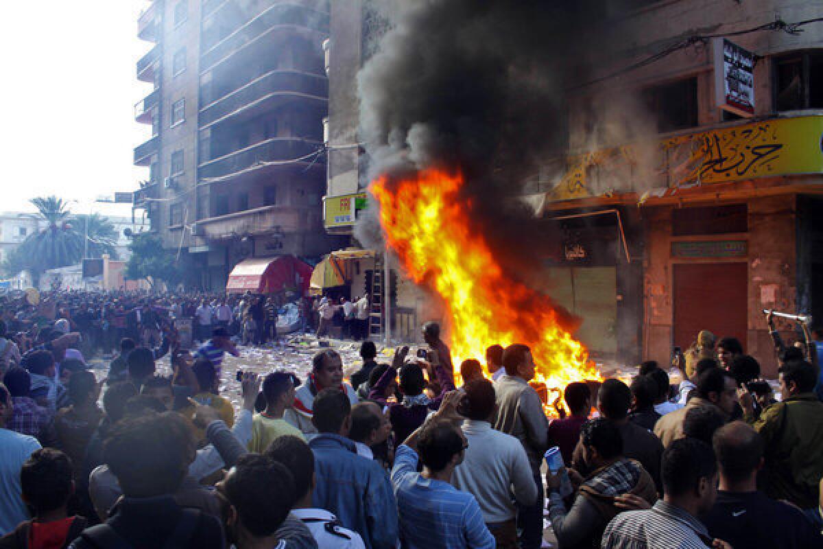 Protesters storm an office of Egyptian President Mohamed Morsi's Muslim Brotherhood Freedom and Justice party and set fires in the Mediterranean port city of Alexandria on Friday.