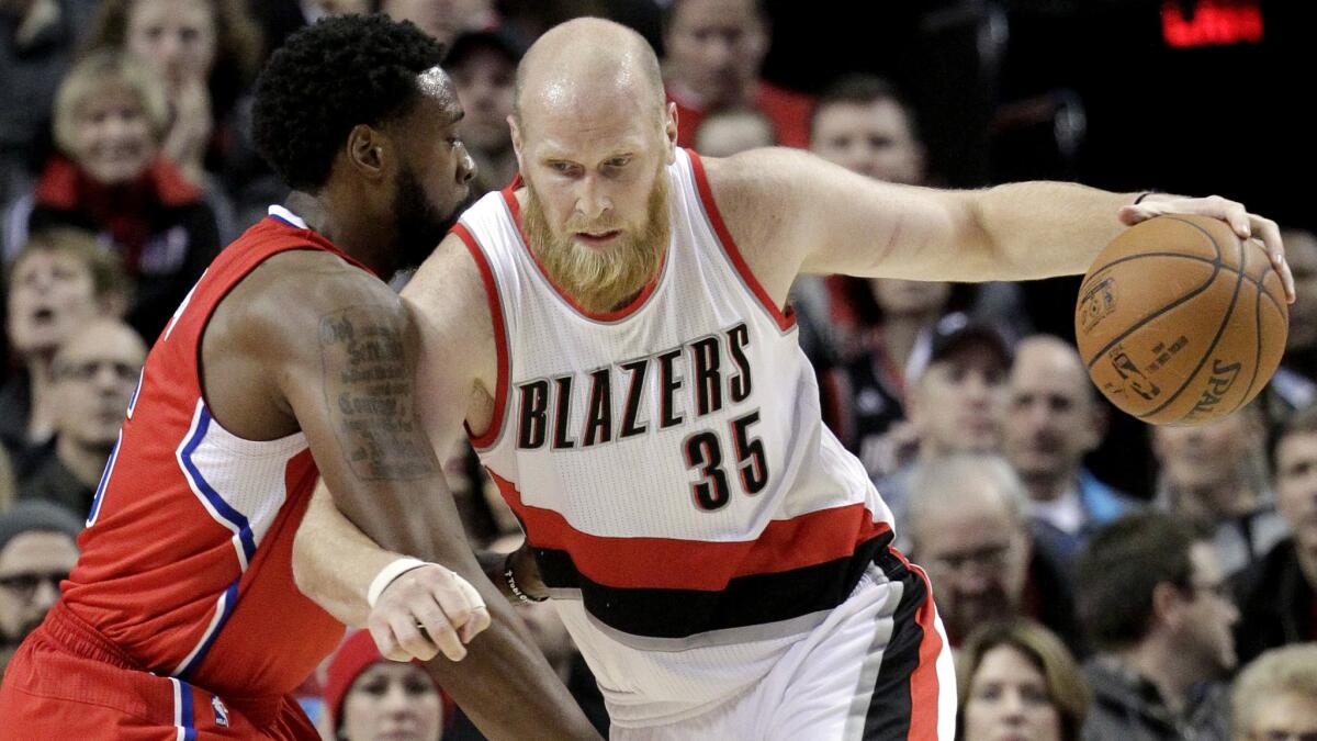 Portland Trail Blazers center Chris Kaman, right, works against Clippers center DeAndre Jordan during a game on Jan. 14.