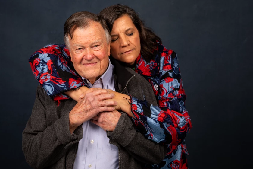 Kirsten Johnson and Dick Johnson hugging.