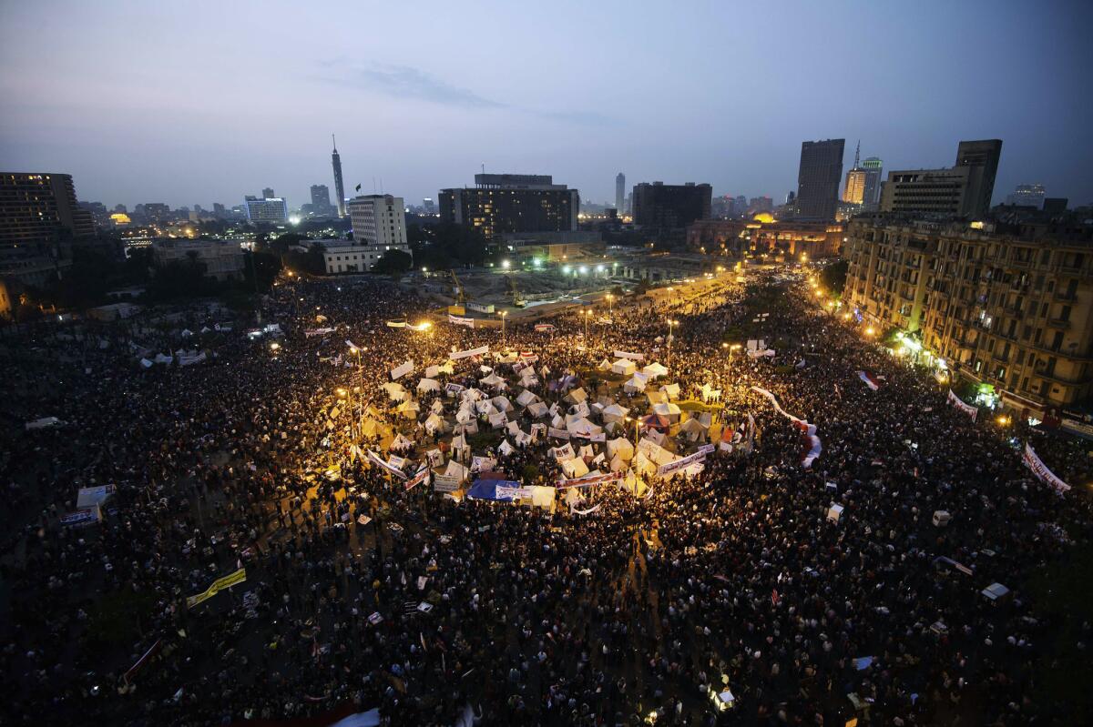 Tens of thousands people take part in a mass rally at Egypt's landmark Tahrir Square in Cairo. The demonstrators are protesting a decree by President Mohamed Morsi granting himself broad powers.
