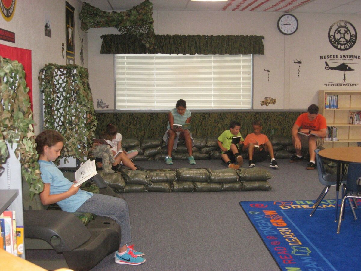 Students enjoy the military-themed Ben Carson Reading Room at Bonsall West Elementary School. The Carson Scholars Fund donated $15,000 for books and materials to refurbish a portable classroom to encourage leisure reading. Courtesy photo