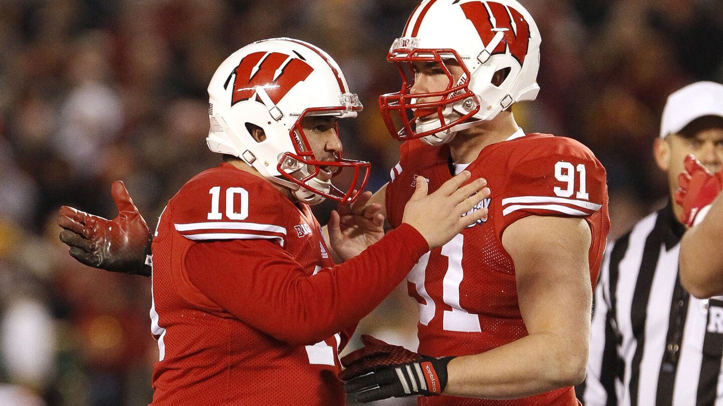 Wisconsin kicker Rafael Gaglianone (10) celebrates with a teammate after making one of his three field goals against USC.