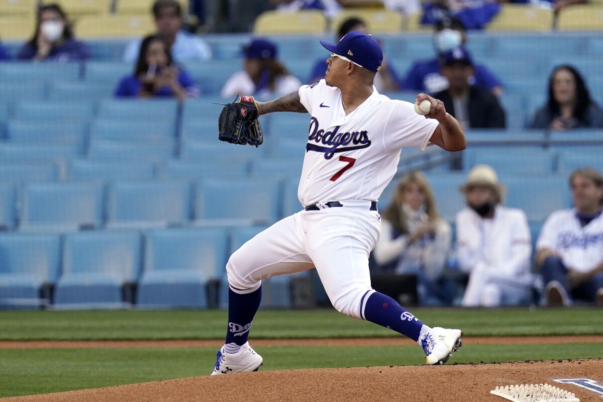 Los Angeles Dodgers starting pitcher Julio Urias throws to the plate during the first inning.