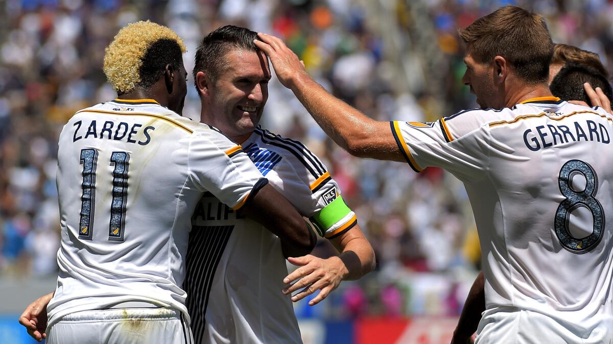 Robbie Keane, center, and the Galaxy will open the MLS campaign at home against D.C. United on March 6. He's flanked by Gyasi Zardes and Steven Gerrard.