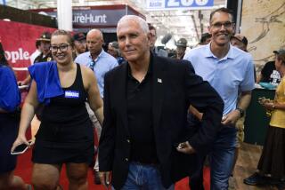FILE - Former Vice President Mike Pence walks through the Varied Industries Building during a visit to the Iowa State Fair, Friday, Aug. 19, 2022, in Des Moines, Iowa. Pence is stepping up his outreach in Iowa ahead of a possible 2024 presidential campaign. (AP Photo/Charlie Neibergall, File)