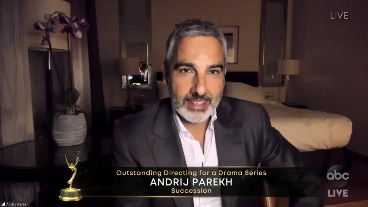 "Succession" director Andrij Parekh accepted the Emmy in a modern bedroom.