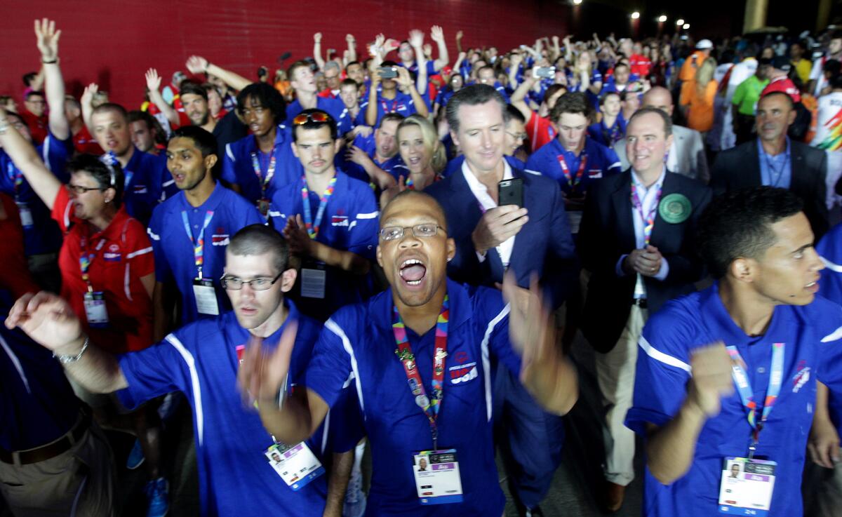 Members of the U.S. team walk into the stadium for the opening ceremony of the Special Olympics World Games on Saturday at the Coliseum.
