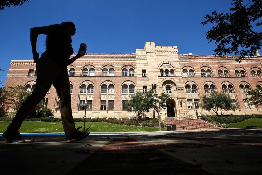 A pedestrian walks near the humanities building on the UCLA campus in Westwood in 2013.