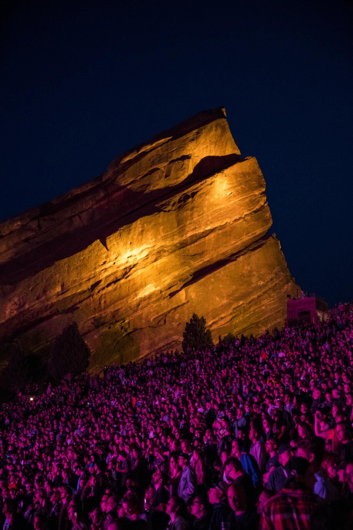 Fans listen as Phantogram/Tycho performs at the Red Rocks Amphitheatre.