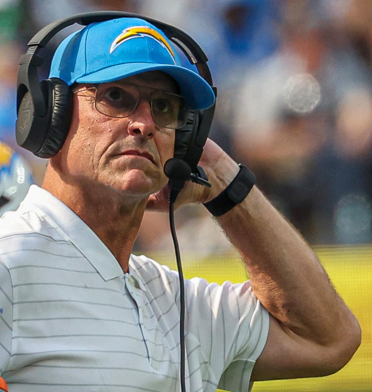 Chargers coach Jim Harbaugh watches from the sideline during a win over the Raiders on Sept. 8.