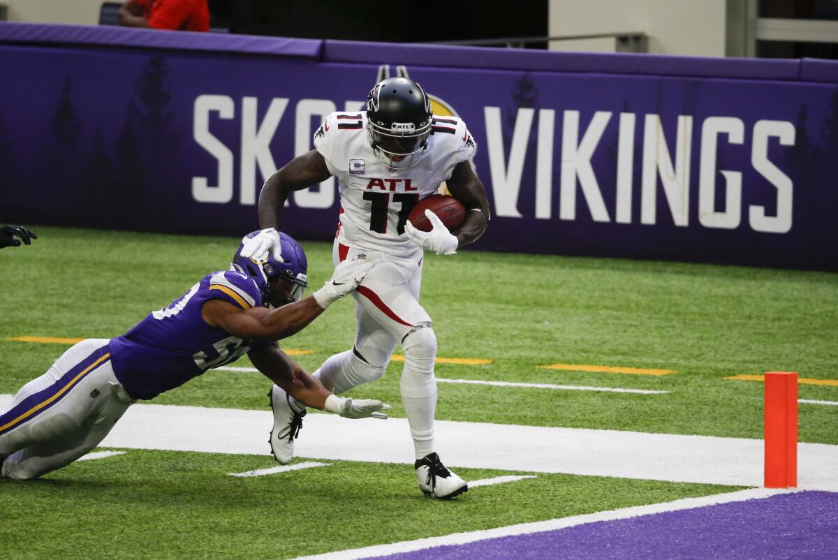 Atlanta Falcons wide receiver Julio Jones breaks away from Minnesota Vikings linebacker Eric Wilson.