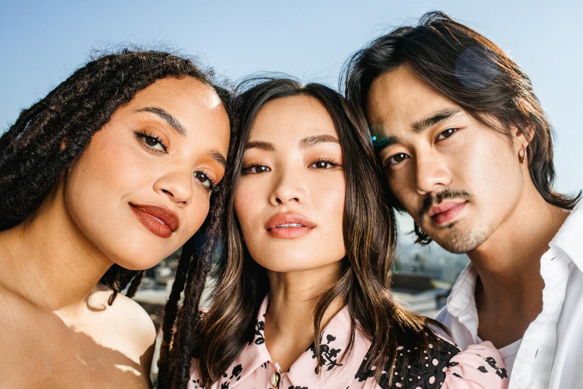 Kiersey Clemons, Anna Sawai and Ren Watabe tilt their heads together for a photo