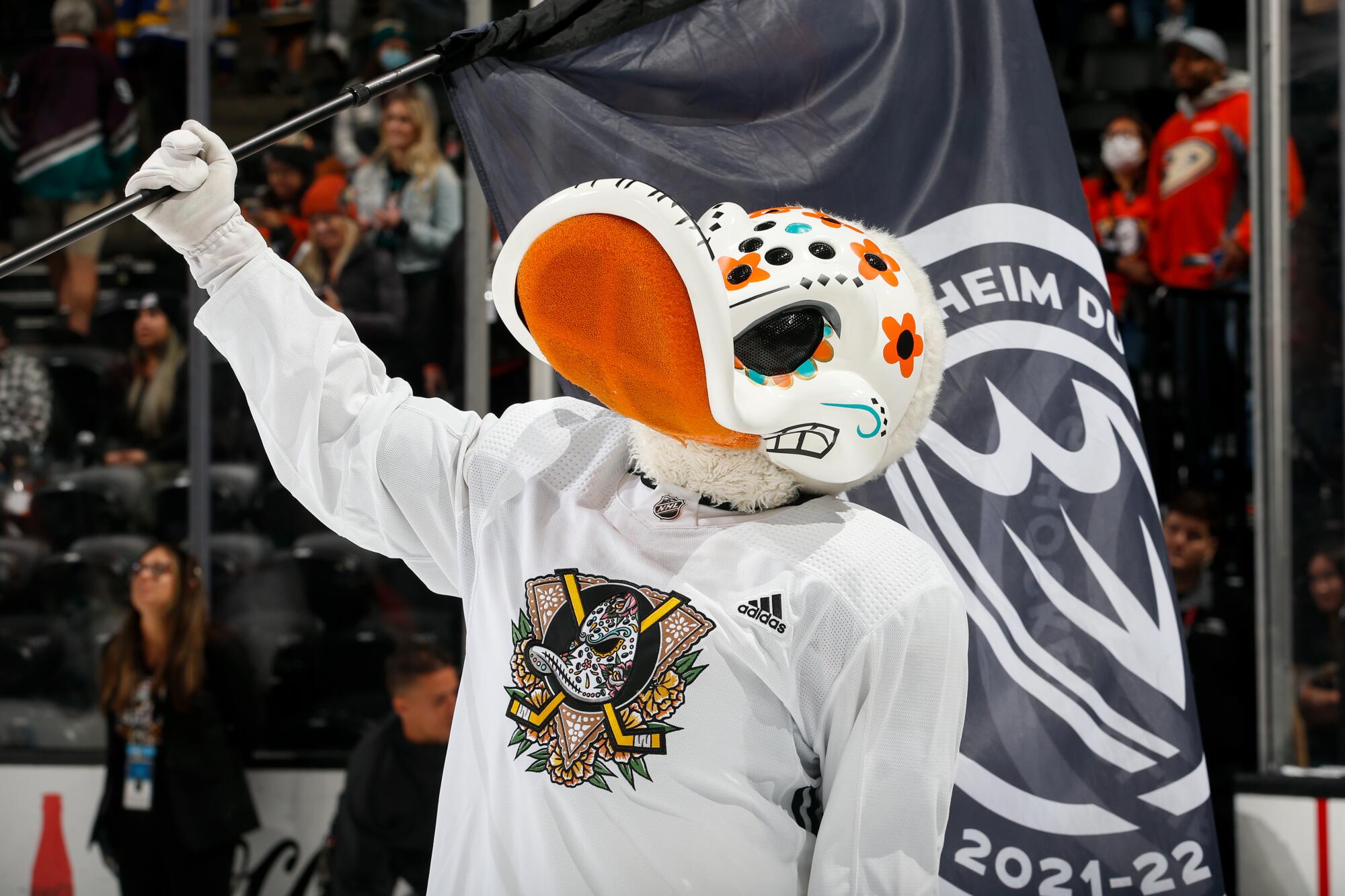 Anaheim Ducks mascot Wild Wing celebrates Día de los Muertos night, with the duck face decorated like a skull 