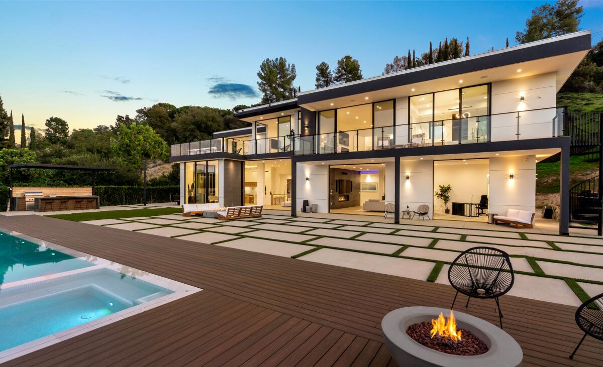 Picture of modern home taken from a pool area