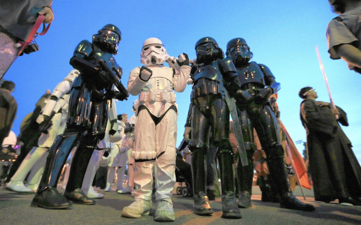 Members of the Orange County Star Wars Society and Friends of the Mouse Disneyland fan club show off their "Star Wars" costumes during the Anaheim Halloween Parade on Oct. 24, 2015.
