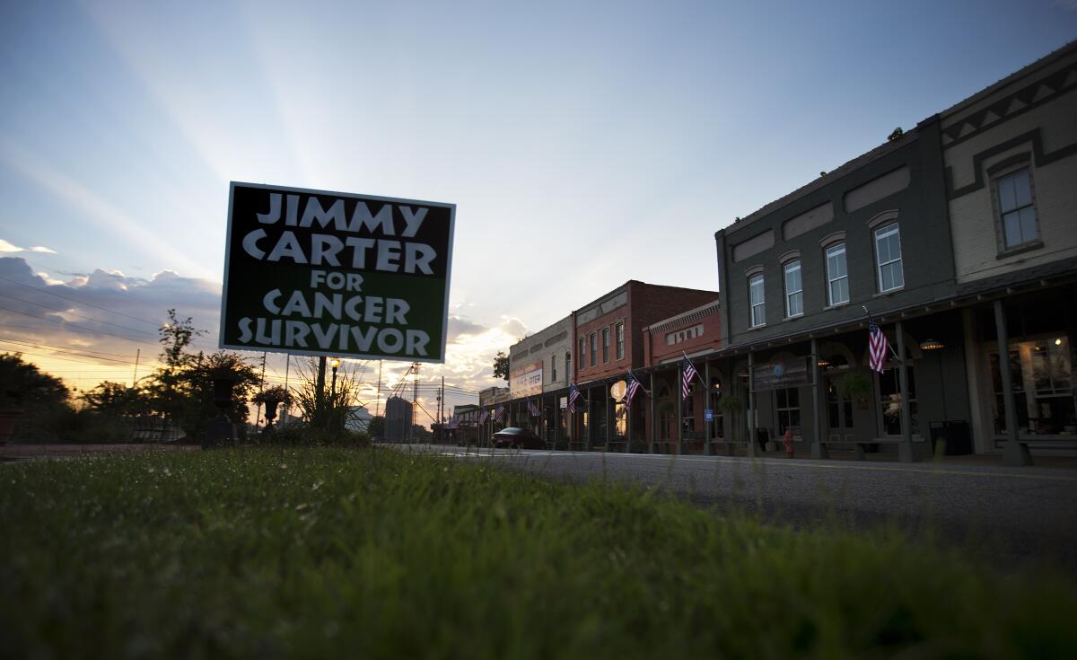 A sign along Main Street in Plains, Ga., cheers President Carter on in his  fight against cancer in 2015.