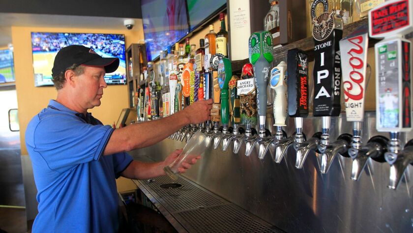 Mike Pasulka, co-owner of Players Sports Grill in Poway and San Marcos, has started working some bartending shifts himself to cut down on labor costs. It's like balancing a scale; when one side goes up the other side goes down, he said.