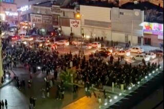 people blocking an intersection during a protest