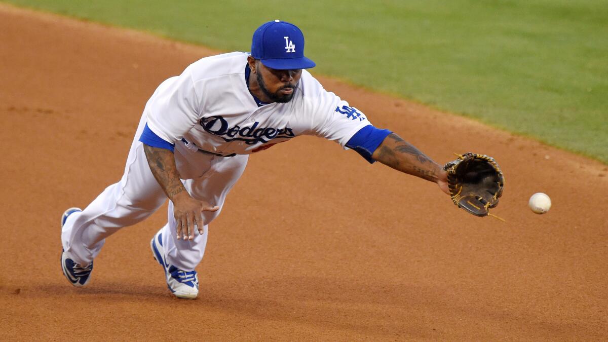 Dodgers second baseman Howie Kendrick can't make a diving stop on a single hit by San Francisco Giants left fielder Nori Aoki during the third inning of the Dodgers' 9-5 loss Friday.