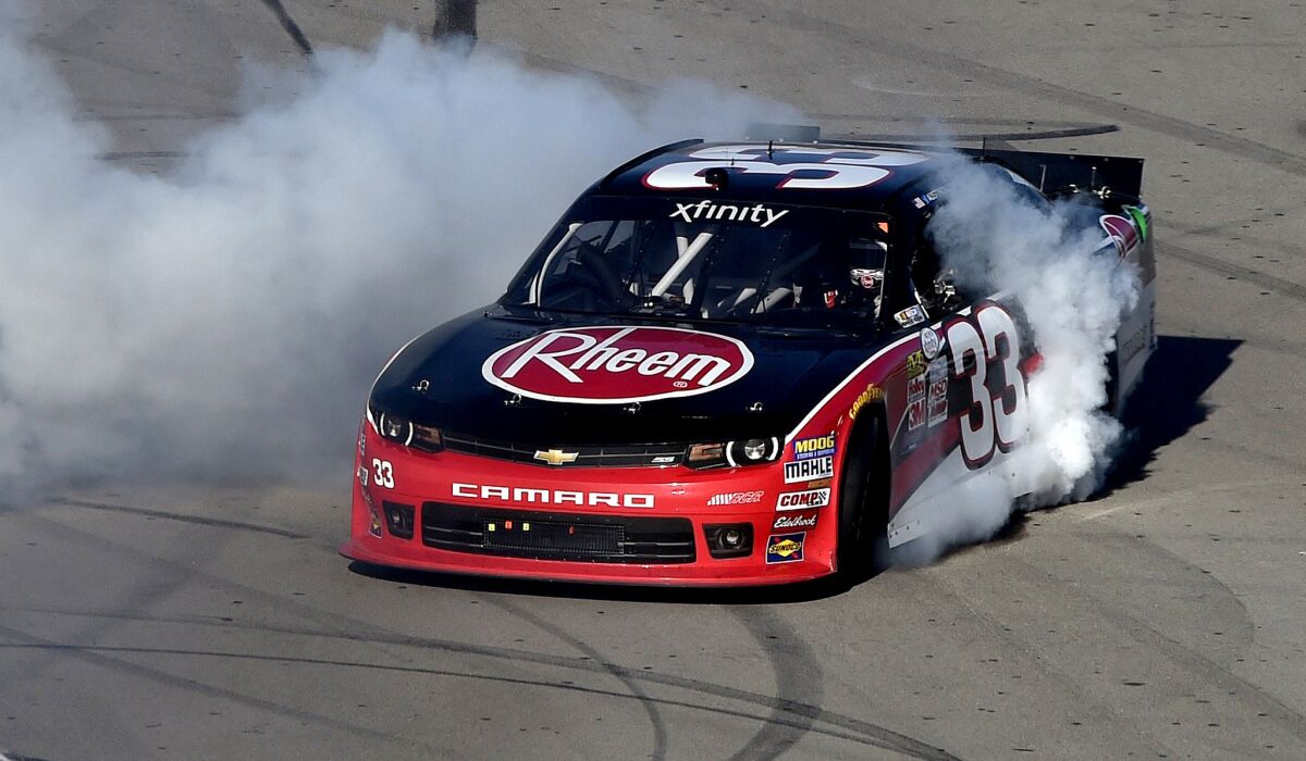Austin Dillon, driver of the No. 33 Rheem Chevrolet, celebrates with a burnout after winning the NASCAR Xfinity Series Boyd Gaming 300 at Las Vegas Motor Speedway on Saturday.
