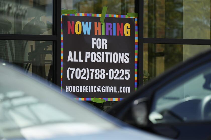 A hiring sign is displayed at a restaurant in Mount Prospect, Ill., Tuesday, Aug. 27, 2024. (AP Photo/Nam Y. Huh)