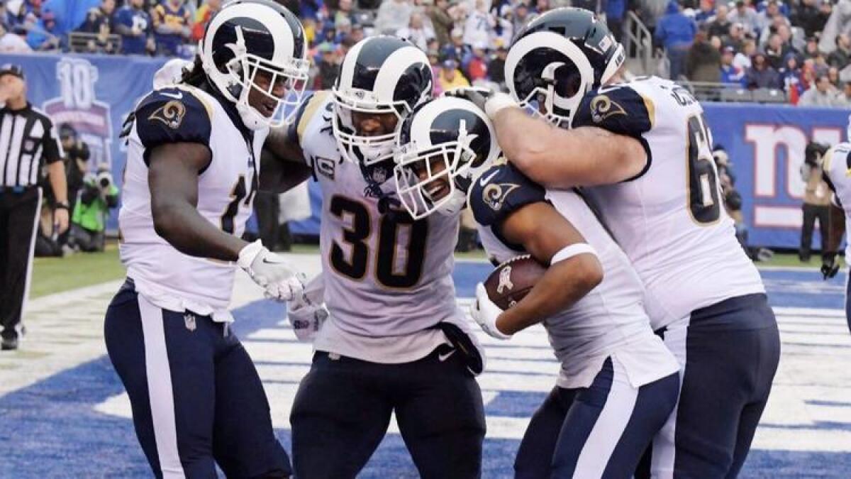 Rams Sammy Watkins (12), Robert Woods, center and Todd Gurley (30) accounted for five touchdowns against the Giants on Sunday at MetLife Stadium.