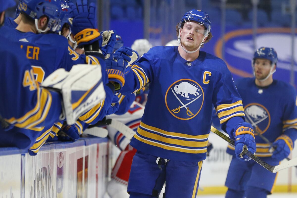 FILE - Buffalo Sabres forward Jack Eichel (9) celebrates his goal during the first period of an NHL hockey game against the New York Rangers, Thursday, Jan. 28, 2021, in Buffalo, N.Y. The Jack Eichel era in Buffalo is over, with a nasty public divorce reaching an eight-month finality on Thursday, Nov. 4, 2021. when the Sabres traded their ex-captain and face of the franchise to the Vegas Golden Knights. (AP Photo/Jeffrey T. Barnes, File)