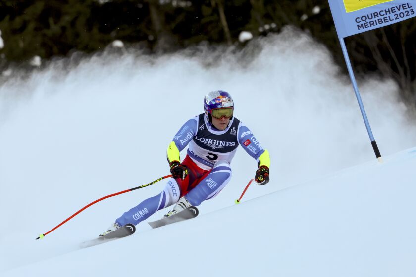 France's Alexis Pinturault speeds down the course during the super G portion of an alpine ski, men's World Championship combined race, in Courchevel, France, Tuesday, Feb. 7, 2023. (AP Photo/Marco Trovati)