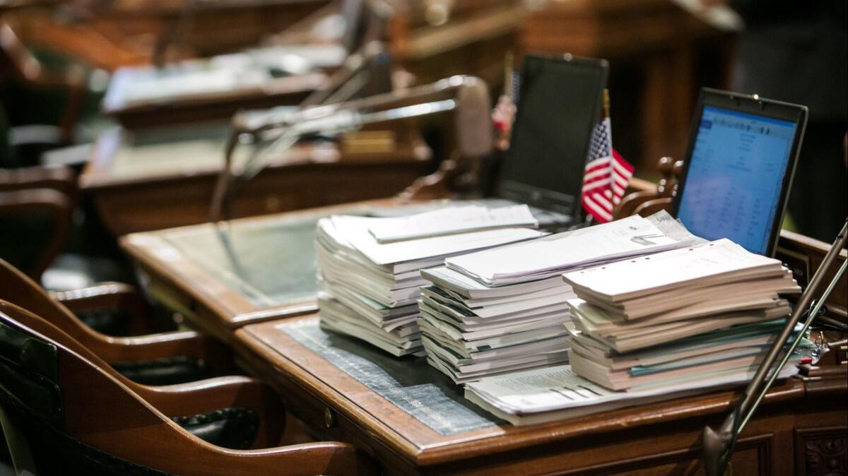 A stack of legislative bills piled up on a lawmaker's desk in the California Assembly.