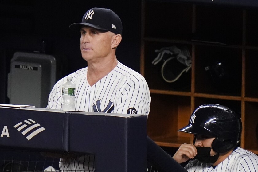 New York Yankees third baseman Phil Nevin, left, watches the eighth inning.