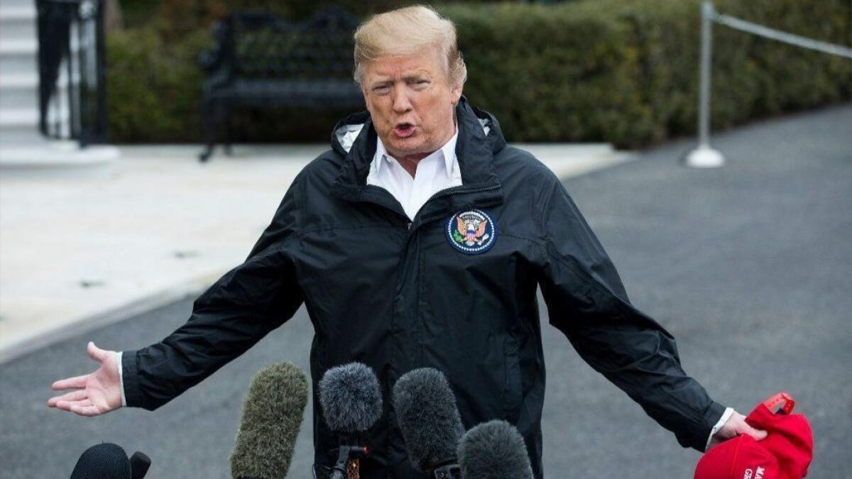 President Trump speaks to reporters March 8 before departing the White House to inspect tornado damage in Alabama and spend the weekend at his Florida resort.