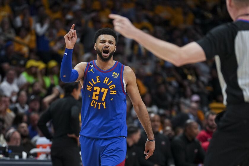Denver Nuggets guard Jamal Murray reacts during the second half of Game 1 of the basketball team'ss NBA Finals against the Miami Heat, Thursday, June 1, 2023, in Denver. (AP Photo/Jack Dempsey)