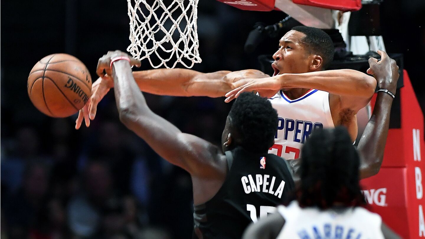 Clippers' Wesley Johnson blocks the shot of Houston Rockets' Clint Capela in the second quarter.