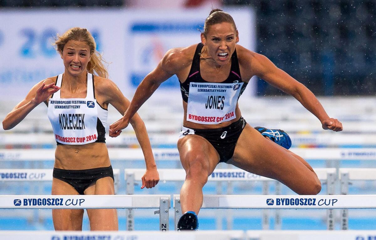 Lolo Jones, right, wins the women's 100-meter hurdles race at the European Athletic Festival Bydgoszcz Cup in Bydgoszcz, Poland, on June 2.
