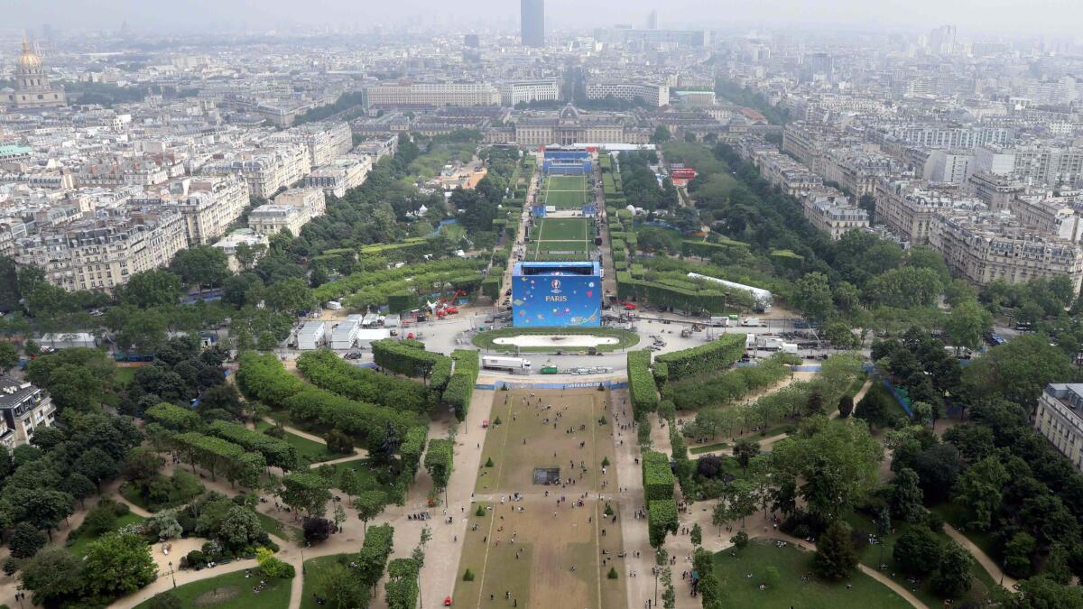 This picture taken on June 6, 2016 shows the UEFA Euro 2016 fan zone site next to the Eiffel Tower at the "Champs de Mars", in Paris.