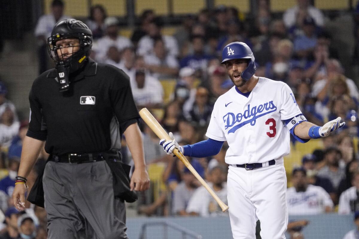 Dodgers batter Chris Taylor argues a call with home plate umpire Manny Gonzalez.