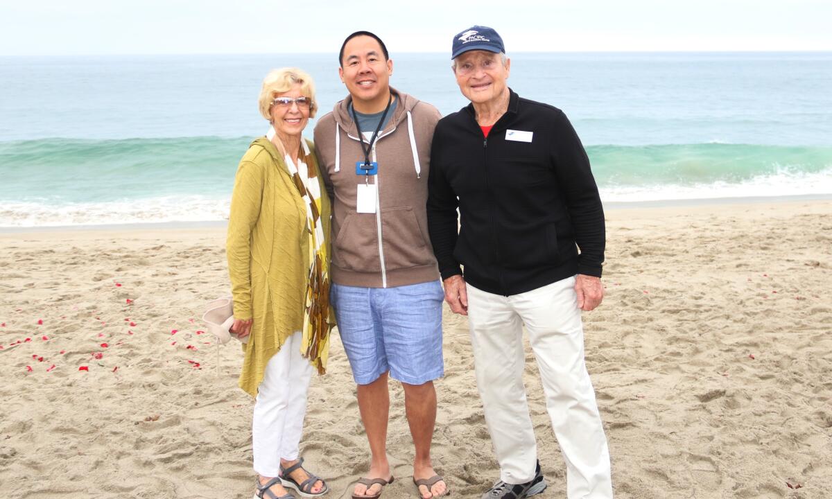 Peter Chang, center, with PMMC co-founder John Cunningham and Stephanie Cunningham at an Aug. 2019 sea lion release.