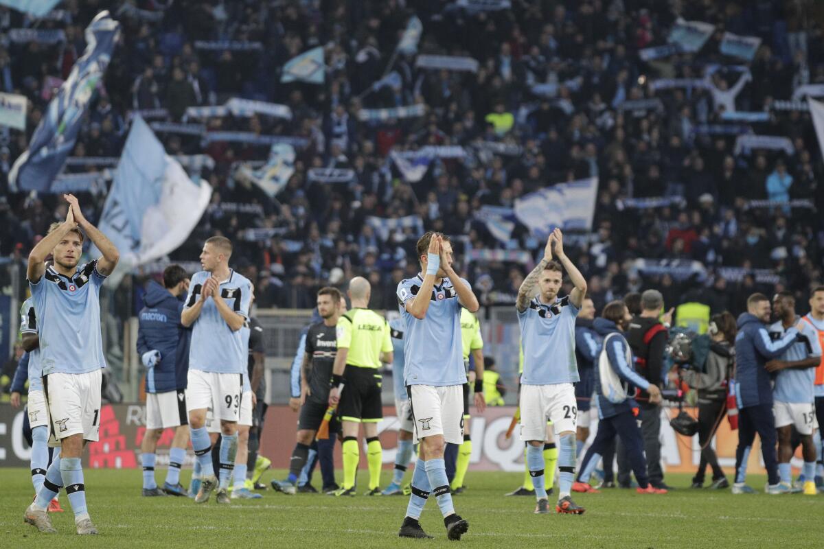 Lazio's players celebrate their victory at the end of the Italian Serie A Soccer match between Lazio and Sampdoria at Rome's Olympic stadium, Saturday, Jan. 18, 2020. Lazio won 5-1.(AP Photo/Andrew Medichini)