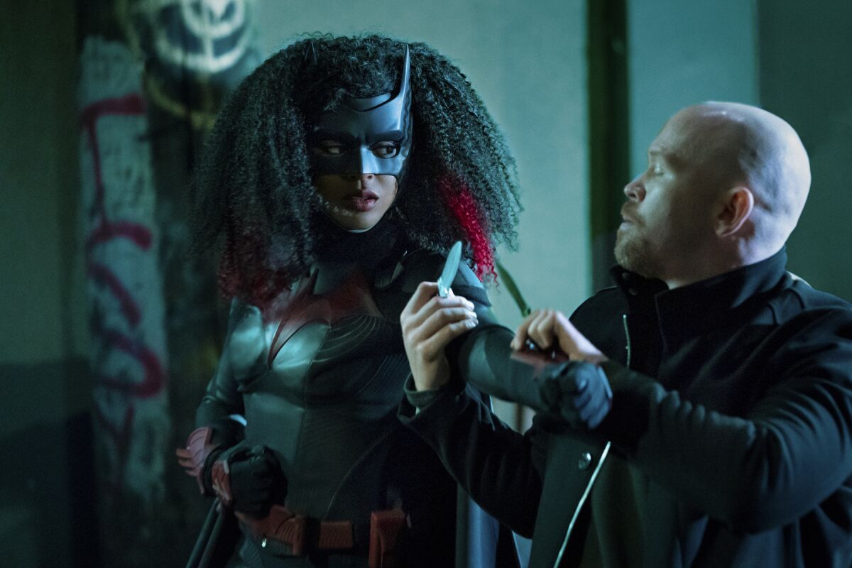 Javicia Leslie as Batwoman in the CW superhero series "Batwoman" and Alex Morf as Victor Zsasz.